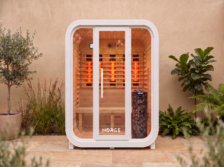 NØRGE Kube 2 person sauna in matte white, courtyard with plants