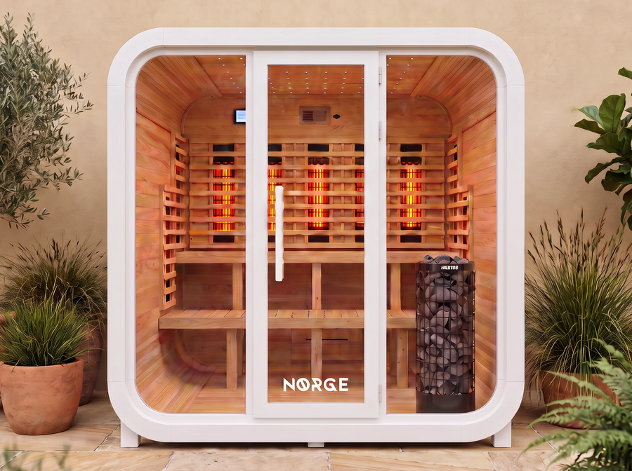 NØRGE Kube 6 person sauna in matte white, courtyard with plants